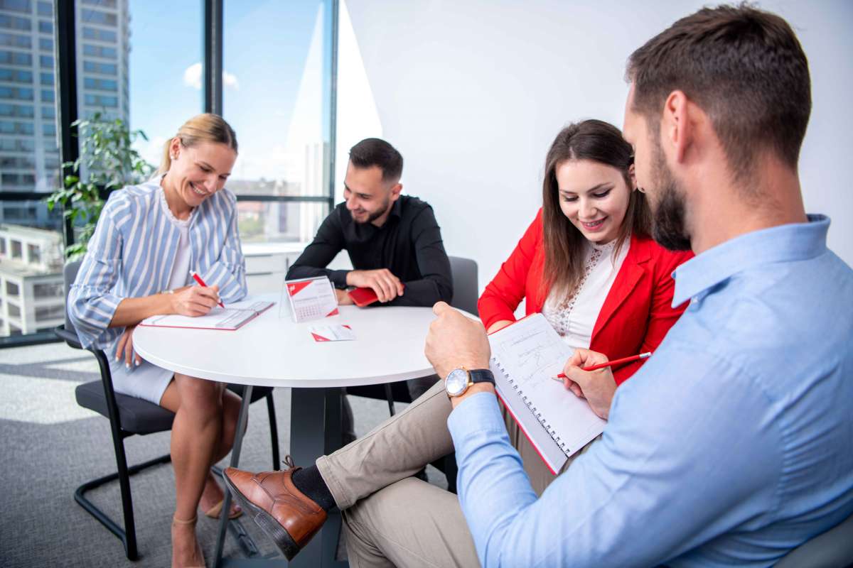 People in modern office at automotive supplier Huf with great view in the background in Timisoara