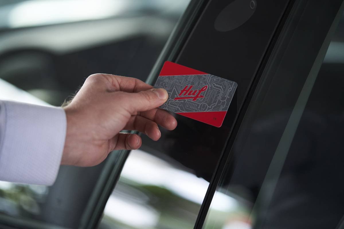 Huf NFC Card in front of smartcard reader in b pillar to unlock a car door