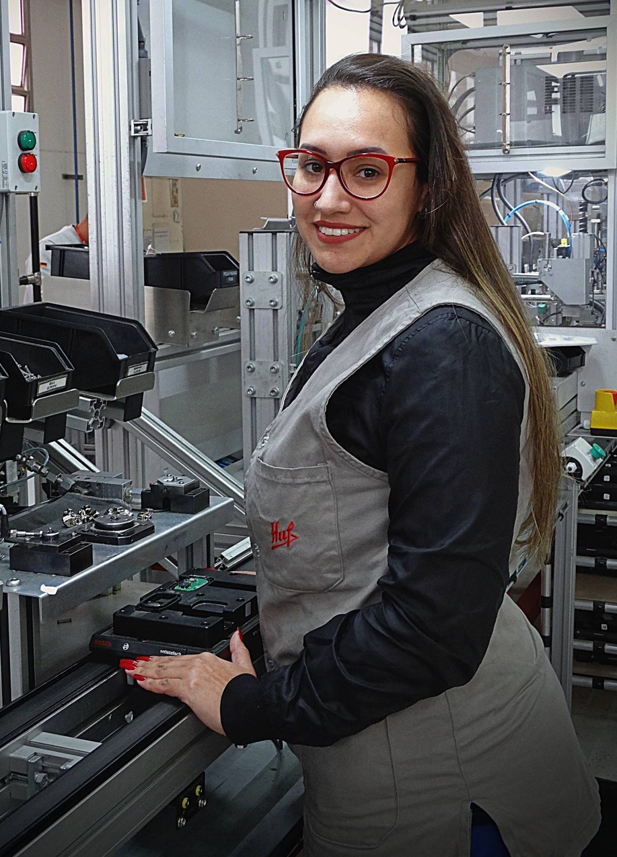 Huf Brazil female worker smiling.