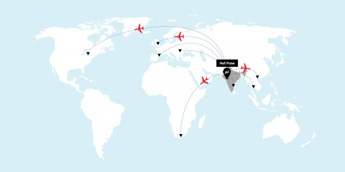 World map with symbolized aircraft flying from Huf India in Pune to customer locations around the world.